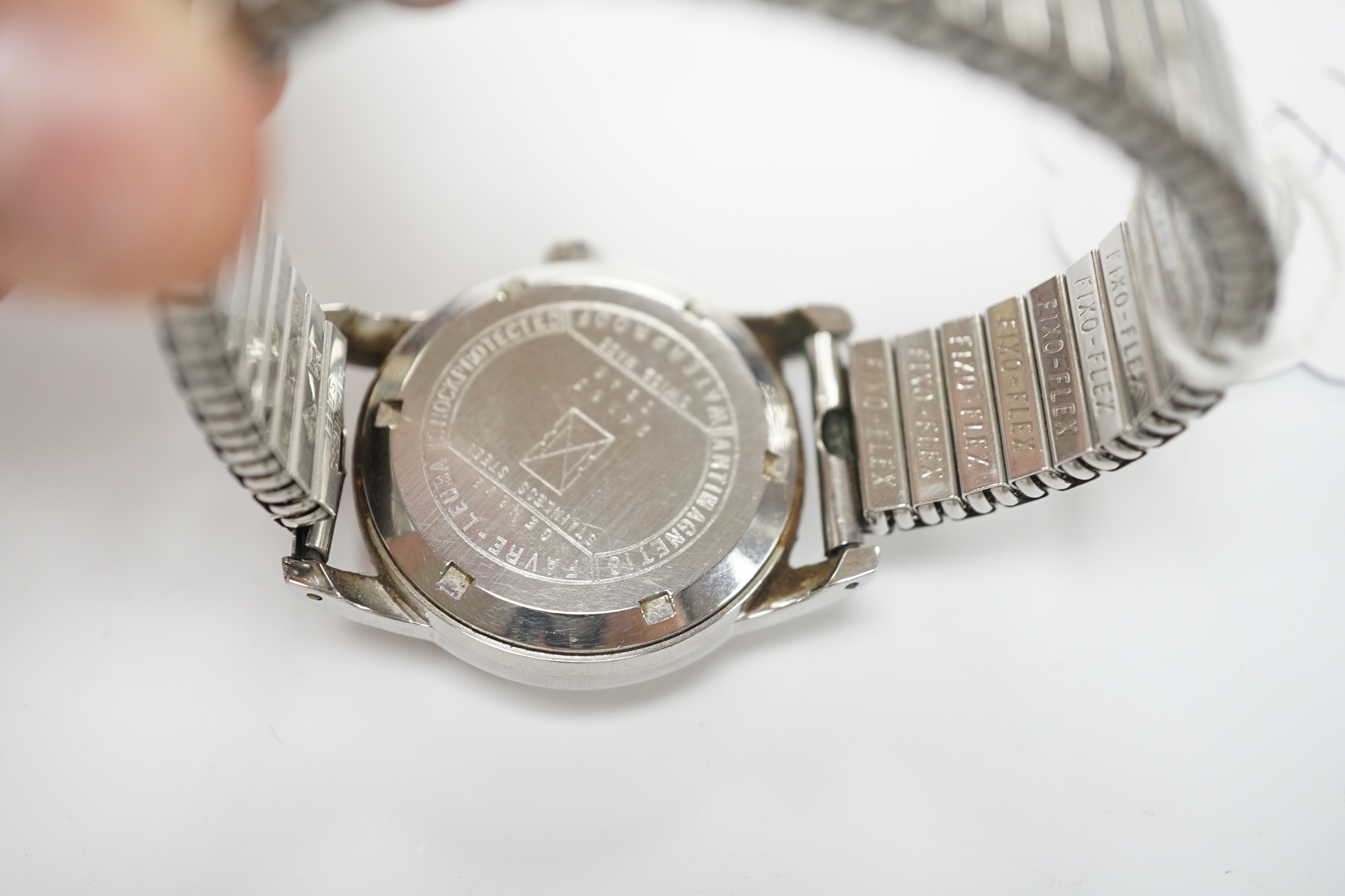 A gentleman's stainless steel Favre Leuba Daymatic manual wind wrist watch, on associated flexible strap.